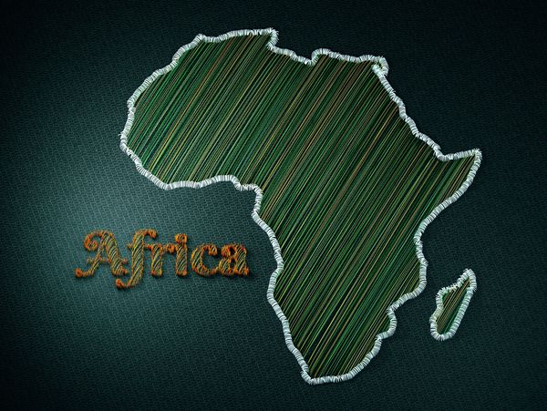 Stylized embroidered map of Africa on dark fabric.