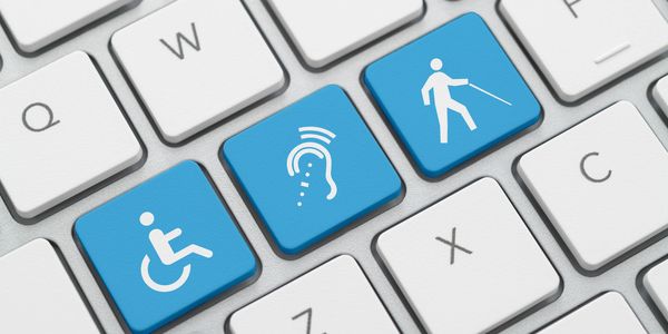 A keyboard showing some keys that disability icons in blue
