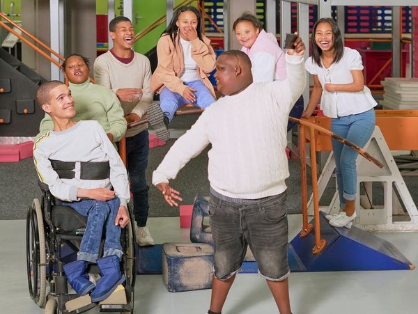 Group of diverse friends having fun together indoors.