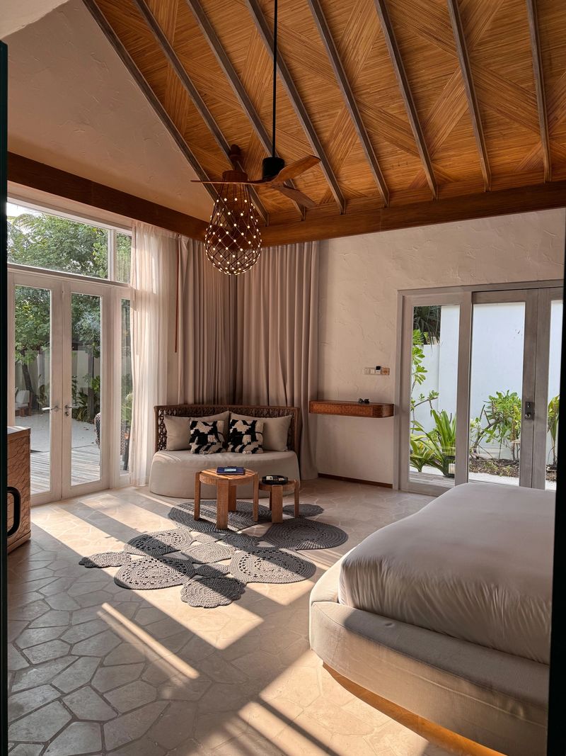Hotel room Beach Villa in luxury Maldives Resort with modern natural interior design with boho style