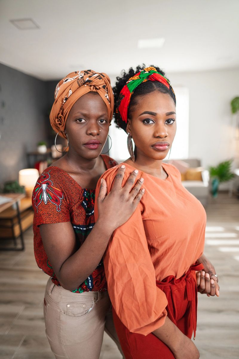 Two beautiful african women are embracing each other, demonstrating sisterhood and togetherness
