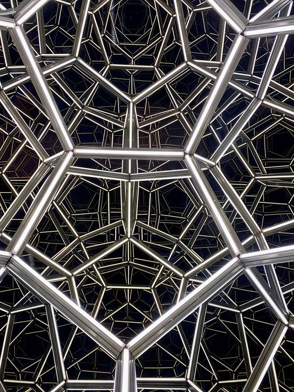 Geometric metal structure resembling Pentagon design, symbolizing secure federal event venues.