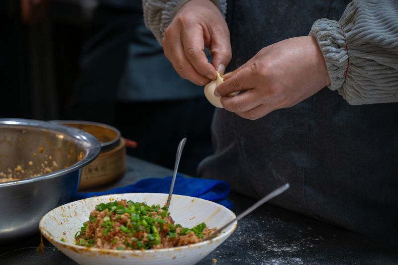 Hand making Chinese baozi