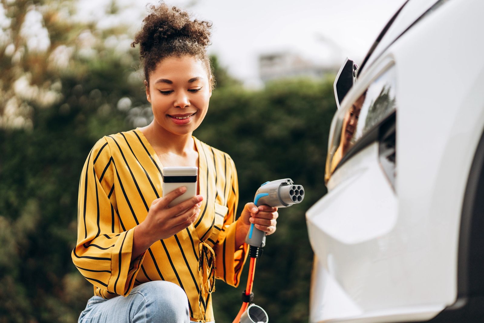 Edge-of-town UK retail park with EV charging driving dwell time and footfall