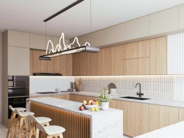 Modern kitchen with wood cabinetry and marble island.