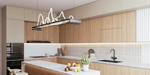 Modern kitchen with wooden cabinets, marble countertops, and artistic lighting.