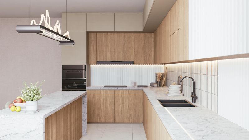 A modern kitchen featuring sleek cabinetry, marble countertops, and stylish lighting, creating a warm and inviting culinary space. 3d rendering.