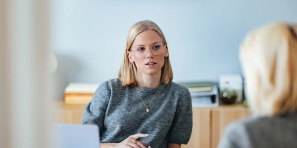 Woman listening intently in a meeting.
