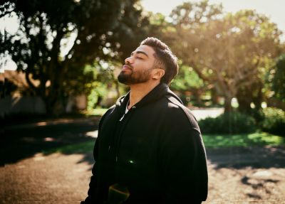 Man enjoying sunlight outdoors.