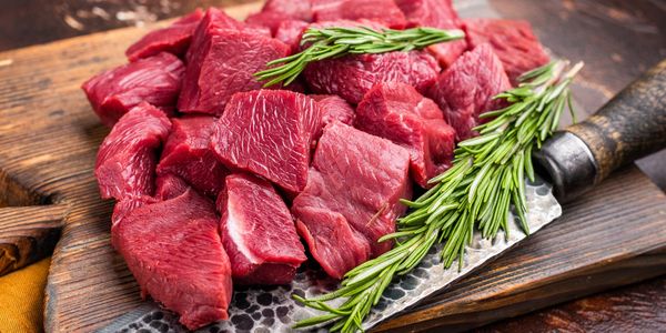 fresh cut venison on cutting board 