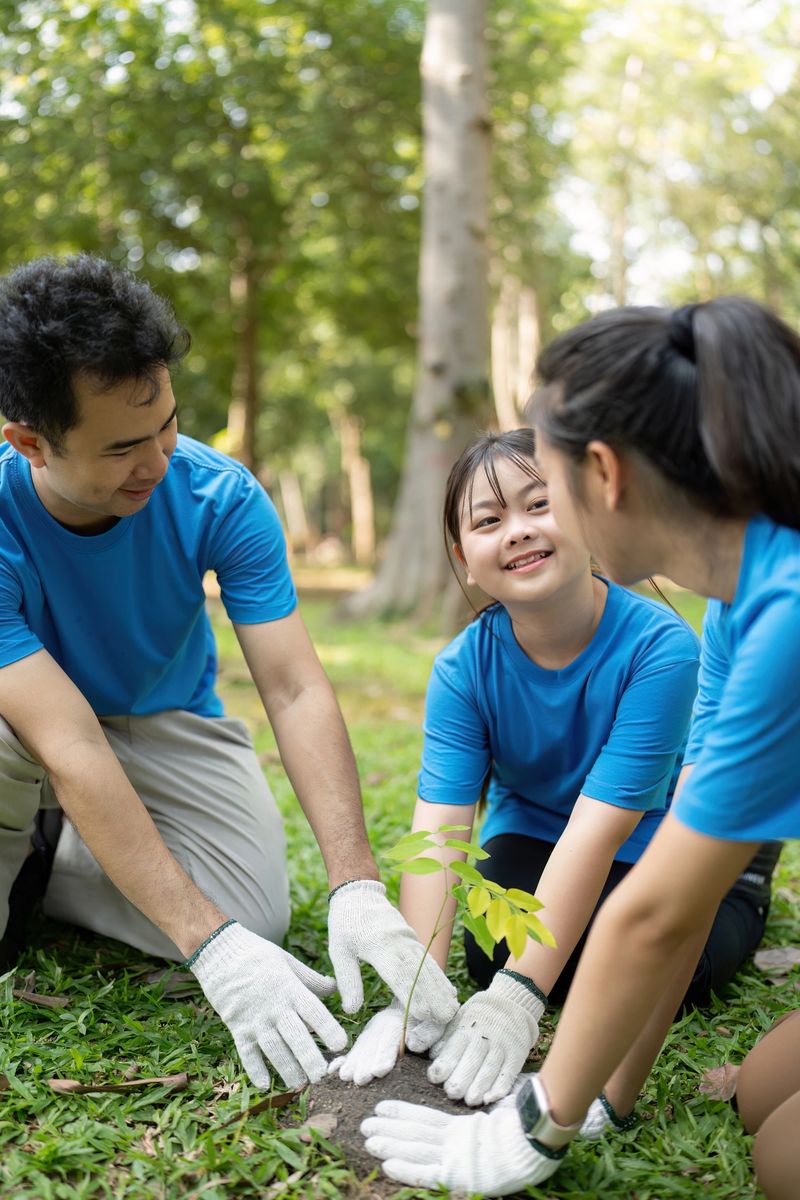 A happy family of volunteers working together to plant a sapling in a sunlit park, reflecting their passion for environmental conservation.