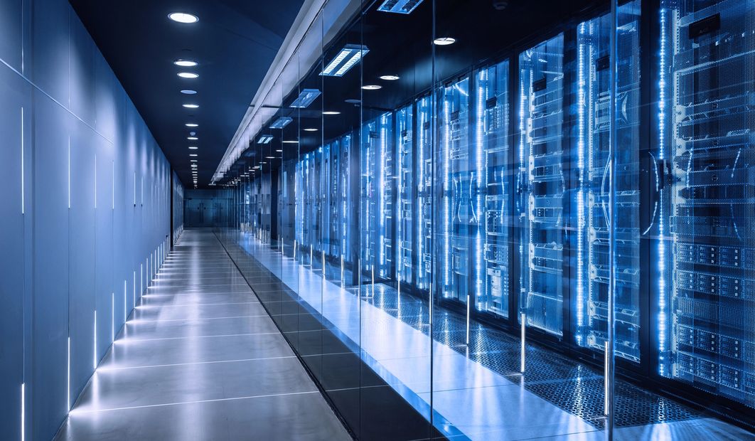 A futuristic data center hallway with glowing blue digital lines.
