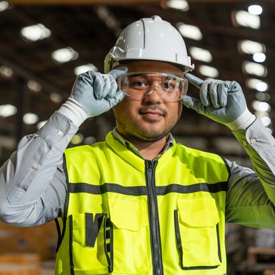 BC industrial worker wearing PPE and safety gear, representing Estrea’s WorkSafeBC safety systems.