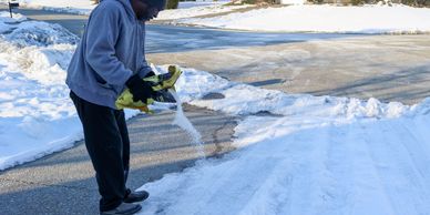 Salting an icy driveway in London, Ontario