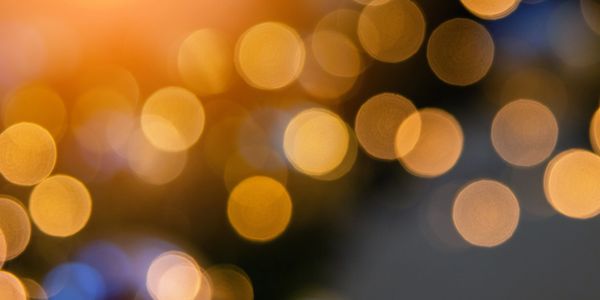 Soft golden bokeh lights creating a warm, festive atmosphere.