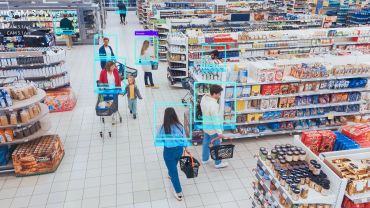 Shoppers with AI facial recognition boxes in a supermarket aisle.