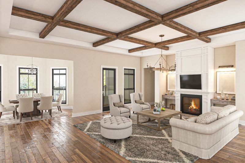 Bright and cozy living room interior with neutral tones, rustic wooden beams, comfortable furniture, and a lit fireplace, creating a warm and inviting atmosphere. Adjacent dining area enhances functionality.