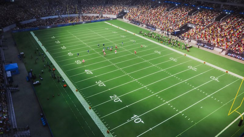 Aerial Shot of Red and Blue American Football Teams Strategically Lining Up and Facing the Opponents. Athletic Players Fight for the Ball in Front of Spectators