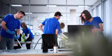 People cleaning an office space.