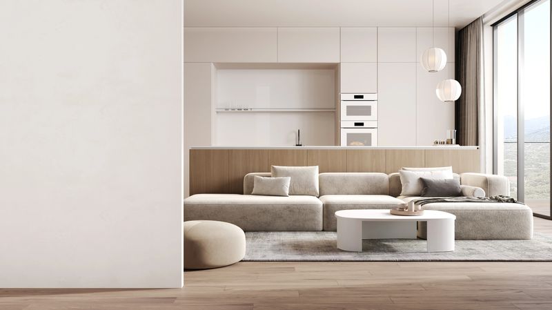 Empty wall and modern kitchen interior with dining area and sofa, 3D Rendering