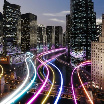 City nightscape with neon light trails on road.