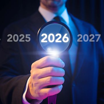 Businessman highlighting the year 2026 with a magnifying glass.