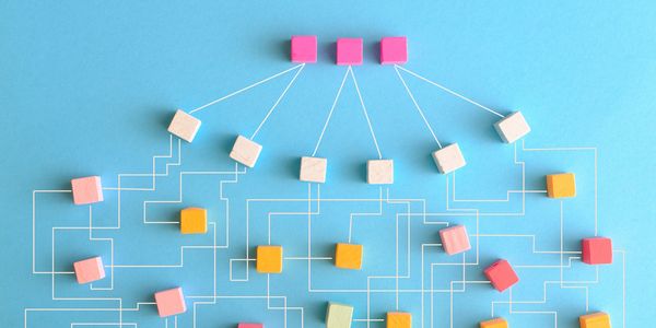 Colorful wooden blocks connected by white lines on a blue background.