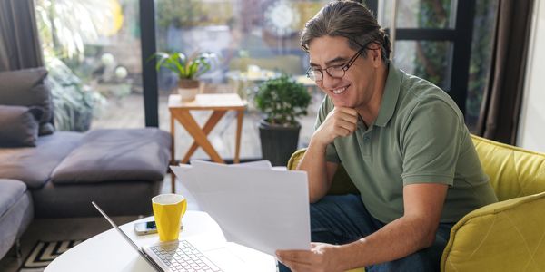 Homeowner reviewing monthly rental income report for property in Vancouver