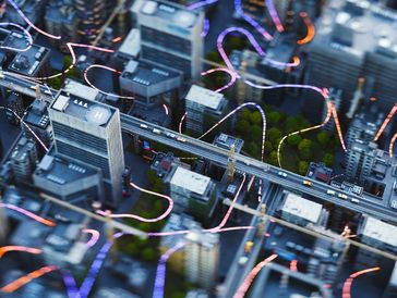 A futuristic cityscape with elevated highways and glowing light trails.