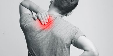 alt="Man with lower and upper back pain"