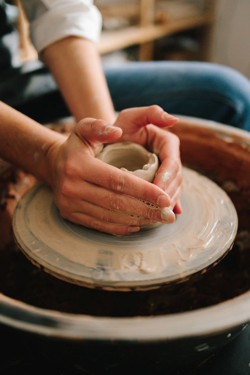 Potter creates a ceramic bowl in the pottery studio. Process of making a unique ceramic shape