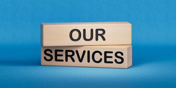 Wooden blocks with 'OUR SERVICES' text on a blue background.