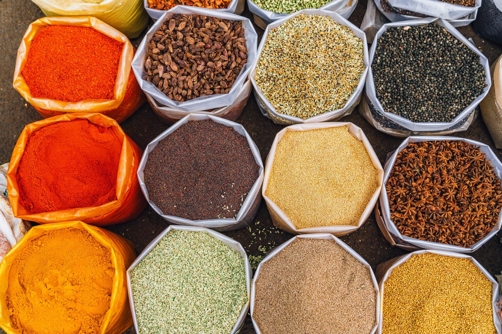 Various spices in sacks at a market.