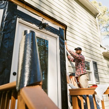 Targeted siding and exterior trim repair around a door on a Colorado home.