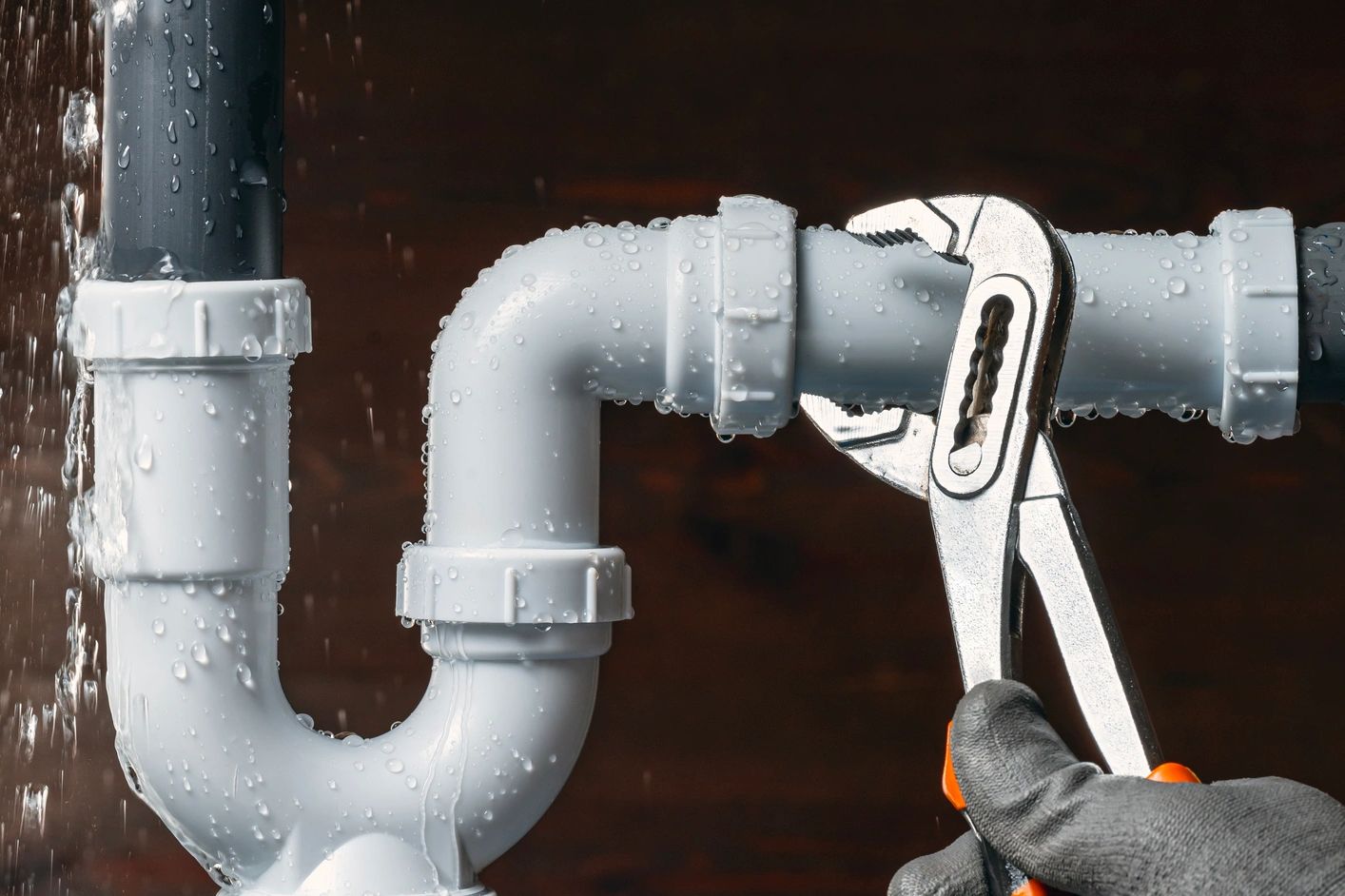 Plumber working on a P-trap in Tickfaw Louisiana.