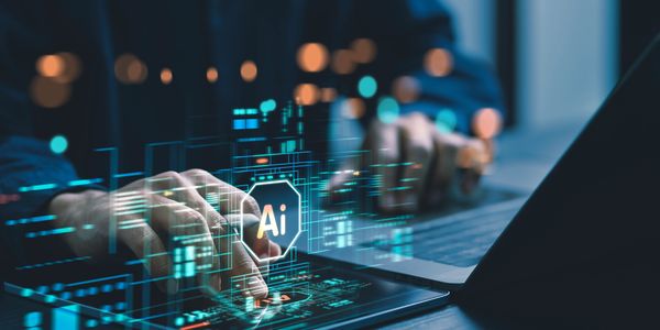 Keyboard with hands and image that says Ai