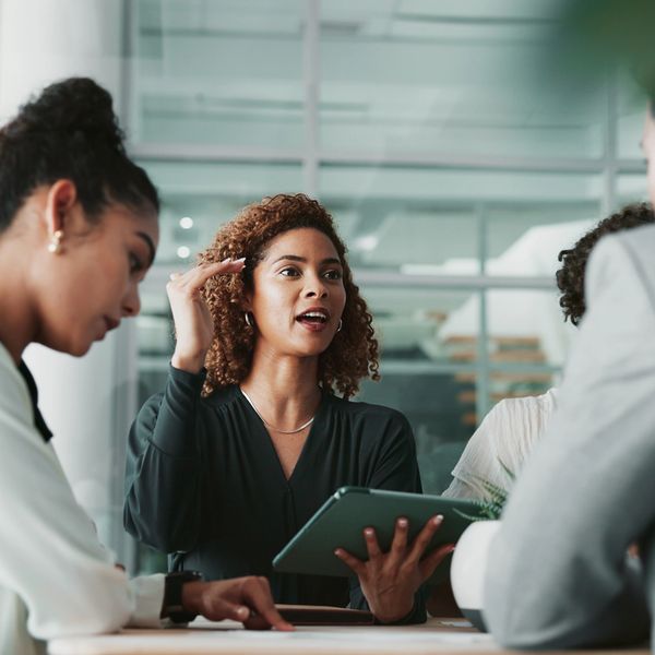 A group of people planning an strategy for a consulting service