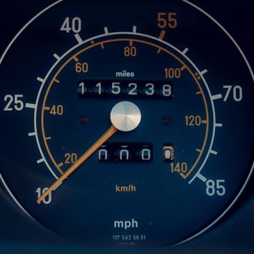 Analog speedometer with odometer symbolizing Florida VIN and odometer verification service.