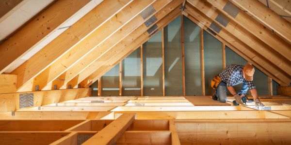 Man working on attic construction.