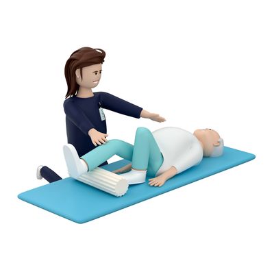A therapist assists an elderly person with leg exercises on a mat.