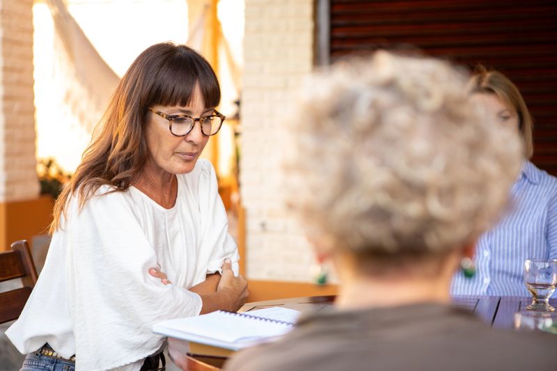 Female coordinator leading group therapy for older women - Buenos Aires - Argentina