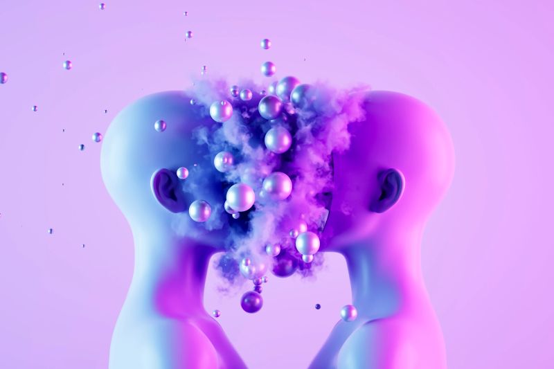 A digitally generated image featuring two human-like heads connected by floating spheres, symbolizing artificial intelligence, neural networks and data exchange. This conceptual design represents advanced machine learning, digital communication and the future of AI-driven technology, making it ideal for innovation, tech and futuristic themes.