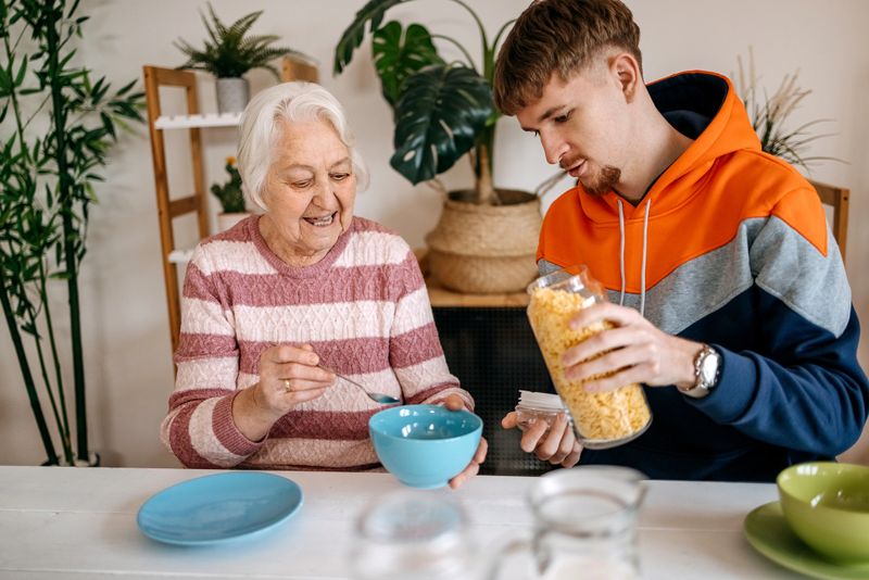 Old people care at home preparing food together and enjoying it