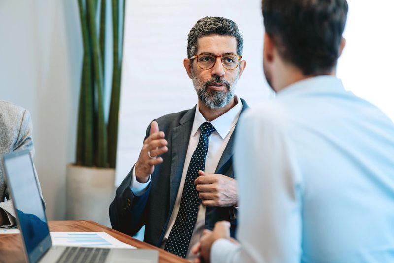 Two businessmen talking