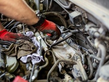 Car engine tune-up service in progress