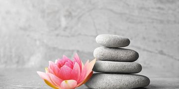 Image of flower and 4 stones.