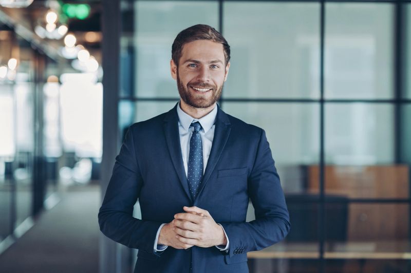 Smiling businessman standing in the office