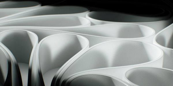 Close-up of curved white plastic containers.