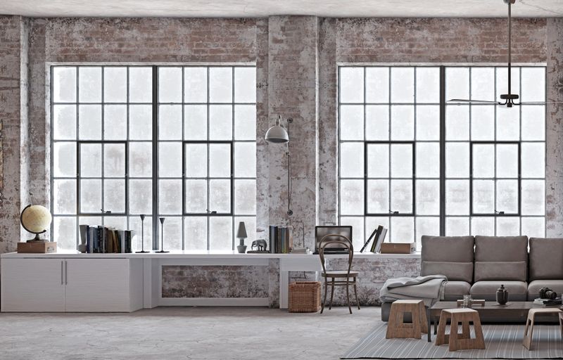 Industrial loft with brick walls, large windows, and modern furniture. 3D rendering.