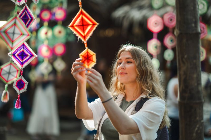A foreign woman tourist admiring traditional craftsmanship while exploring the local market, surprised by the intricate designs and the skill of local artists